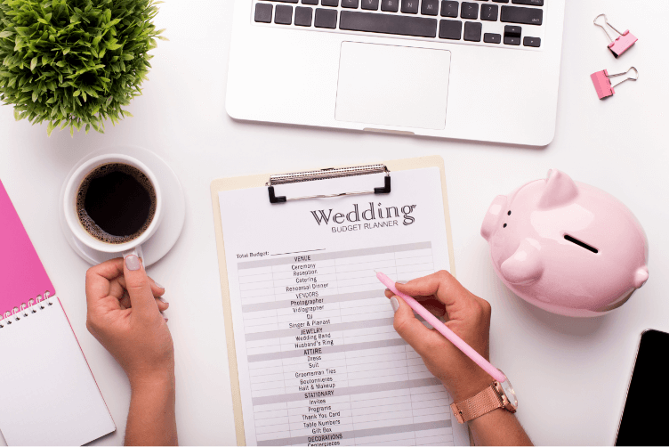 Person using a wedding budget planner