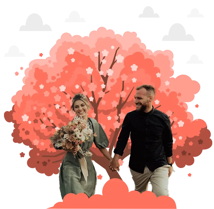 Couple walking in front of tree