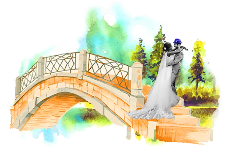 bride and groom standing next to a bridge