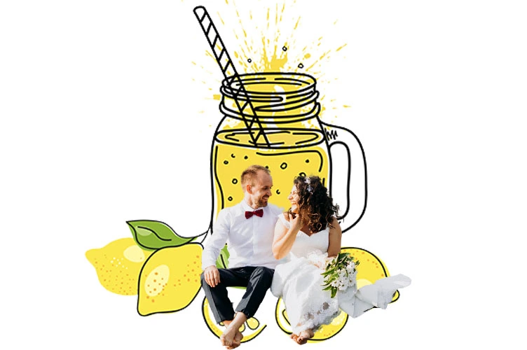 Bride and groom sitting in front of lemonade